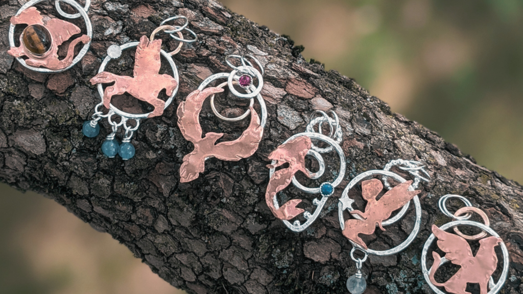 Six mixed metal handmade pendants with fantasy silhouettes by Seashore Design Studio. Etsy SEO Ilana Leah LLC